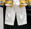 Ropa infantil coreana 2026 colección otoño/invierno nueva: Cárdigan de punto a rayas amarillas, suéter para niños y pantalones de pierna recta, un conjunto de dos piezas