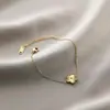 Pulsera de acero de titanio Jin Hui no se decolora cruzada popular femenina trébol de cinco hojas diamante estilo Ins personalidad chapado al vacío 18K