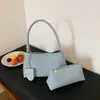 Bolsa Transversal Simples Francesa Tecida Baguete Feminina 2026 Verão Novo Estilo Temperamento Bolsa Mãe e Filho Trajeto Diário Bolsa de Axila