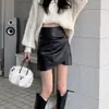 Elegante falda de mujer 2026 primavera/otoño nueva adelgazante de cuero PU corta de cintura alta para petite falda de línea A falda ajustada al cuerpo