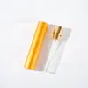 En stock 10ML botella dispensadora de perfume giratoria de dos secciones con carcasa de aluminio, botella pulverizadora oral cosmética, botella de perfume de vidrio, botella vacía