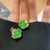 Aretes de Flor de Trébol de Cuatro Hojas Fresca Estilo Mori de Alta Calidad Dulces de Doble Cara Piedra Ojo de Gato Pendientes Versátiles
