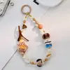 Novo Cordão de Celular Fofo com Estampa de Leopardo para Meninas com Bolinha de Pelo e Acessórios de Estrela, Corrente de Câmera CCD Feita à Mão com Contas, Estilo Curto