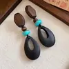 Pendientes de borla con carcasa de madera marrón transfronterizos europeos y americanos, pendientes de estilo vintage Maillard, pendientes de mujer de lujo ligero de alta gama