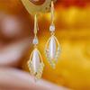 Pendientes de lujo ligeros de alta gama con piedra de ojo de gato para mujer, elegantes, con diseño de nicho, borlas largas y superllamativas, que combinan con todo.