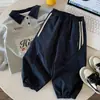 Calça infantil Muye de outono casual, calça longa versátil para meninos, estilo coreano, calça de moletom jogger, calça cargo estilosa para bebês, moderna