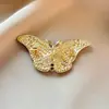 Broche de mariposa para mujer, de alta gama, exquisito, moderno, adecuado para decorar abrigos y suéteres, elegante y lujoso, al por mayor