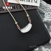 Colar Clavícula Curvo Sorriso Olho de Gato Cor de Gelo Natural para Mulheres Corda Trançada à Mão Estilo de Design de Ponta Colar Venda por Atacado