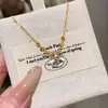 Venta al por mayor de fábrica pulsera de jade de espuma de agua natural roja de departamento pequeño diseño de rosquilla plata s925 incrustada nuevo diseño chino de lujo ligero