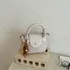 Bolso de mano pequeño para mujer 2026 nuevo moda primavera/verano bolso de hombro para el trabajo con diseño único bolso cruzado