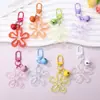 Llavero con hebilla de flor hueca transparente fresca y colorida, accesorio de campana, colgante para bolso, venta al por mayor