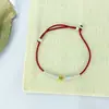 Pulseira de Cordão Vermelho Envolto em Moeda de Ouro de Prata de Lei S925 para Mulheres Novo Design de Nicho Chinoiserie High-End Ano Animal Cordão Trançado