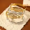 Europa y Estados Unidos pulsera de acero de titanio para casting transfronterizo chapada en oro de 18 quilates microincrustada alta gama joyería de estilo frío pulsera de acero inoxidable