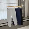 ¡Estilo de pierna cónica! ¡Tejido Toray de capa de aire! Moda masculina otoño e invierno color liso cremallera versátil hoja curva pantalones casuales