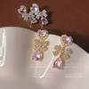 Pendientes de princesa con circonita rosa de textura ligera y lujosa para mujer, de estilo industrial pesado, de alta gama, con diseño de hada elegante.