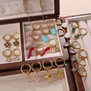Pendientes Europeos y Americanos de Acero Inoxidable Nuevos Pendientes de Flor de Cuatro Hojas Elegantes Simples Versátiles Pendientes de Estrás de Gama Alta Joyería