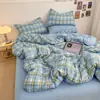 Juego de cuatro piezas de algodón lavado a rayas y color liso, estilo simple de dos tonos, suave y amigable con la piel, funda de edredón individual, adecuada para todas las estaciones, disponible para envío directo