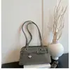 Coleção nova de 2026: bolsa pingente em formato de estrela, uma bolsa de mão elegante e sofisticada para mulheres, uma bolsa de ombro versátil e uma bolsa prática para o dia a dia