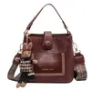 Bolso retro de alta gama para mujer, nuevo estilo coreano 2024, moderno bolso bandolera de hombro, diseño de nicho, bolso tipo cubo portátil