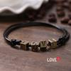Pulsera tejida a mano vintage cuerda negra hombres y mujeres moda cartas de juego cuerda roja trébol de cuatro hojas cuerda de mano simple venta al por mayor