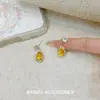 Pendientes de Gota de Agua Amarillos de Temperamento de Lujo Ligero Exquisitos de Nicho Elegantes de Moda Versátiles Pendientes de Gota de Agua de Gama Alta