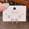 Verano nuevo chapado en oro real exquisitos tres pares de aretes pequeños de alto sentido pequeños frescos dulces aretes de temperamento combinables