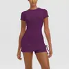 Nuevo producto transfronterizo: Falda corta plisada de color liso con cordón, conjunto de dos piezas para yoga, running y fitness de manga corta para mujer