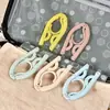 Percha plegable de plástico portátil para viajes al aire libre, percha de viaje de colores, percha para niños