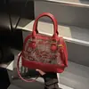 Bolsa tote casual, minimalista e estilosa para o dia a dia, apresentando um design de concha, da coleção outono 2026, com bordado estilo chinês e um estilo chique, de ombro único ou transversal