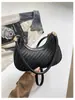 Bolso de mujer de venta caliente transfronterizo 2026 nuevo diseño de moda versátil bandolera tipo dumplings bolso de hombro tejido simple para debajo del brazo para mujer