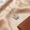 Popular collar de mariposa transfronterizo para mujer, colgante de cobre con incrustaciones de circonita de nicho de lujo ligero, joyería de cadena para clavícula elegante y sofisticada