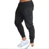 Pantalones deportivos de color liso para hombre, transfronterizos europeos y americanos, corte ajustado, pierna cónica, pantalones largos atléticos, cordón, pantalones casuales para correr y fitness