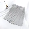 Venta al por mayor del fabricante Pantalones de dormir de cinco puntos para hombre de verano, algodón modal, finos, holgados, talla grande, shorts de playa para uso doméstico