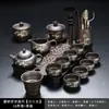 Juego de té de arcilla púrpura con diseño de bambú dorado, que incluye una tetera y tazas de servicio para uso doméstico, con un asa para prevenir quemaduras y asegurar la distribución uniforme del té