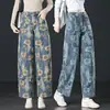 Pantalones vaqueros de estilo pintura al óleo artística con estampado retro Shui Fu 2026 Otoño Nuevos de Cintura Alta Sueltos Pierna Ancha Plátano