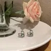 2023 nueva moda amor diseño nicho pendientes femeninos aguja de plata S925 clip de oreja simple tendencia joyería al por mayor
