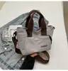 Bolso Minimalista Vintage para Mujer 2026 Nuevo de Moda Versátil Bolso para el Almuerzo Bolso Cesta de Nicho para Viajes Diarios
