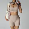Nuevo conjunto de yoga transfronterizo: Shorts de fitness tipo durazno sin costuras que levantan los glúteos con almohadillas en el pecho, top deportivo y sujetador de yoga