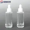 Botella gotero ovalada de cuatro caras de alta gama de 30 ml, botella de esencia de fondo grueso, materiales de embalaje de botellas cosméticas de aceite esencial de vidrio al por mayor