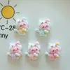 Accesorios de resina de gatito de dibujos animados clip para el pelo de gel de crema joyería DIY pegatina para refrigerador cadena para teléfono móvil agujero material para zapatos al por mayor