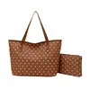 El popular bolso tipo cubo de estilo fresco de este año para mujer es el nuevo modelo de verano 2026 con lunares, un elegante bolso de hombro y un bolso para madre e hija para llevar debajo del brazo.