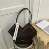 Bolso de hombro tejido con patrón transfronterizo para mujer, nuevo bolso de hombro de diseño de nicho de moda otoño e invierno 2026, bolso de mano popular