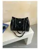 Bolso de cadena con patrón de rombos para mujer, nuevo modelo de otoño 2026, bolso de hombro de lujo ligero vintage de alta gama para el día a día, bolso cruzado tipo cubo