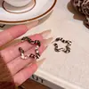 Pendientes Retro Estilo Hong Kong Otoño e Invierno Estampado Leopardo Estrella de Cinco Puntas para Mujer, Estilo Dulce y Fresco Sexy, Pendientes de Estrella de Moda y Versátiles