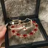 Pulsera de Serpiente de Rubí de Lujo Ligero 2025 Año Nuevo Moda Pulsera Apilada Pulsera de Animales de Gama Alta