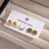 Pendientes de acero inoxidable transfronterizos europeos y americanos para mujer, cuentas redondas de color dorado, estrellas de esmalte negro, juego de pendientes de moda de tres piezas con circonitas