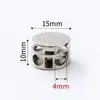 Hebilla de resorte de metal picado de doble agujero hebilla cilíndrica hebilla de ajuste elástico para suéteres pantalones fabricantes descuento por cantidad al por mayor