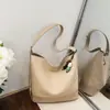 Bolso tejido para mujer, bolso tipo cubo de moda, nuevo bolso de axila de nicho moderno 2026, bolso pequeño de un solo hombro cruzado con textura vintage