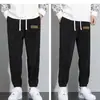 Calças casuais engrossadas Outono Masculino Novo Veludo Cotelê Quente Costura Masculina Pacote Pé Calças Esportivas Na moda All-match