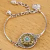 Pulsera de aleación de estilo étnico chino, accesorio metálico de nicho con flor de loto y sensación de alta gama, decoración al por mayor